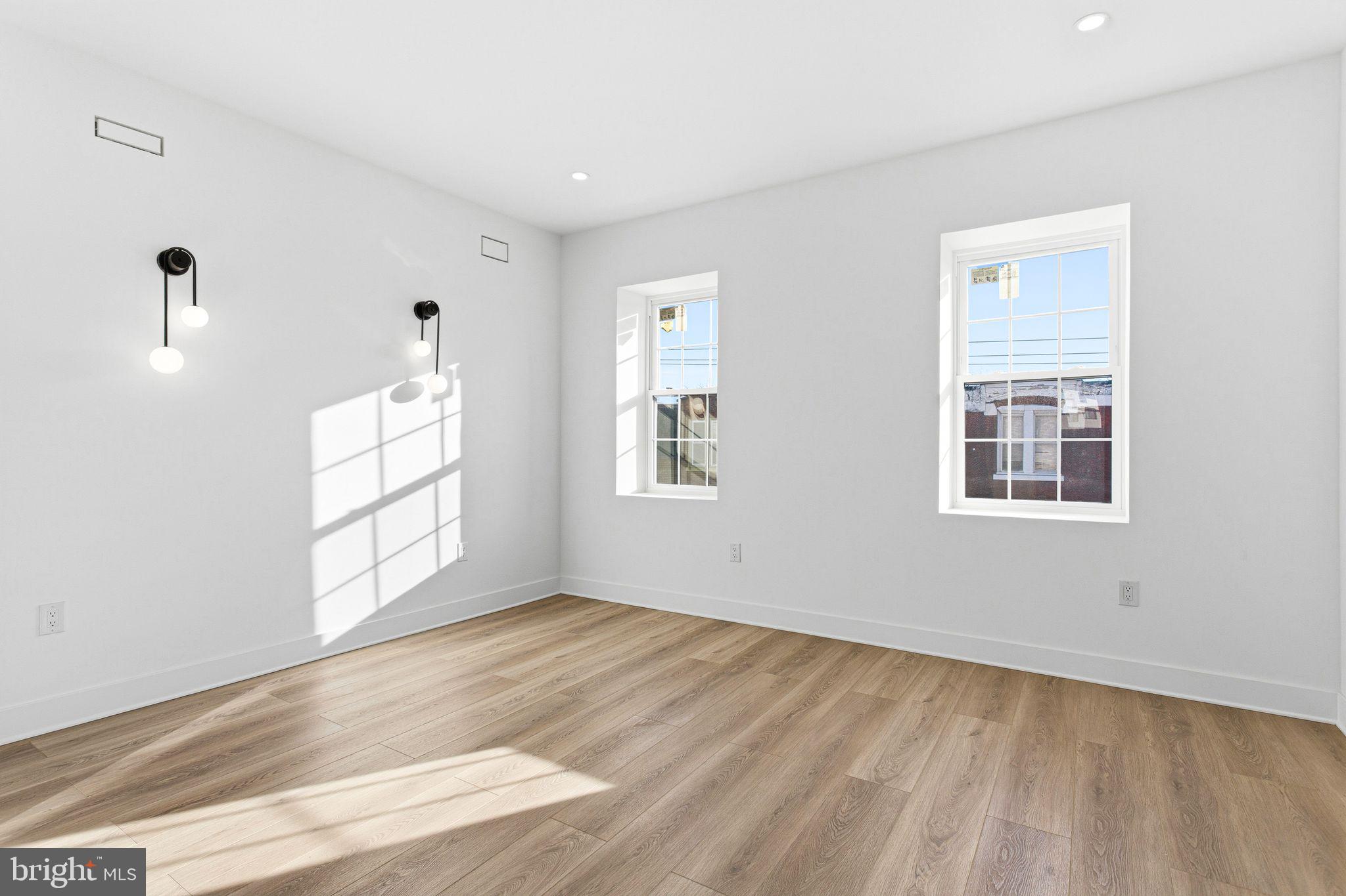 1419 Wharton Street Philadelphia, PA 19146 - Photo 23 of 39 a view of empty room with wooden floor and fan