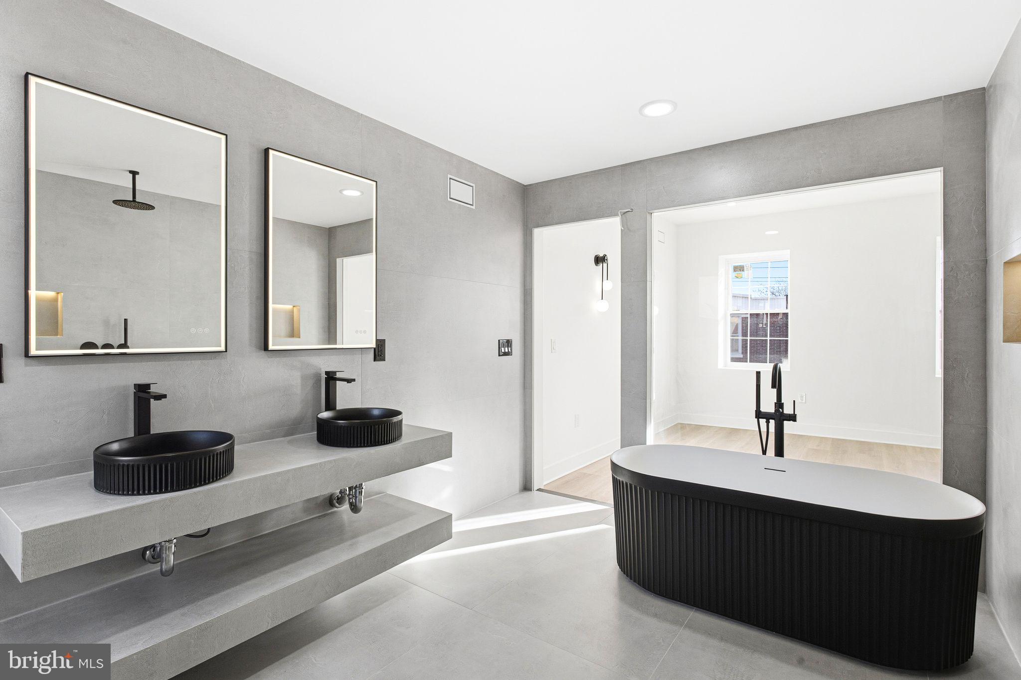 1419 Wharton Street Philadelphia, PA 19146 - Photo 26 of 39 a room with a sink and a mirror