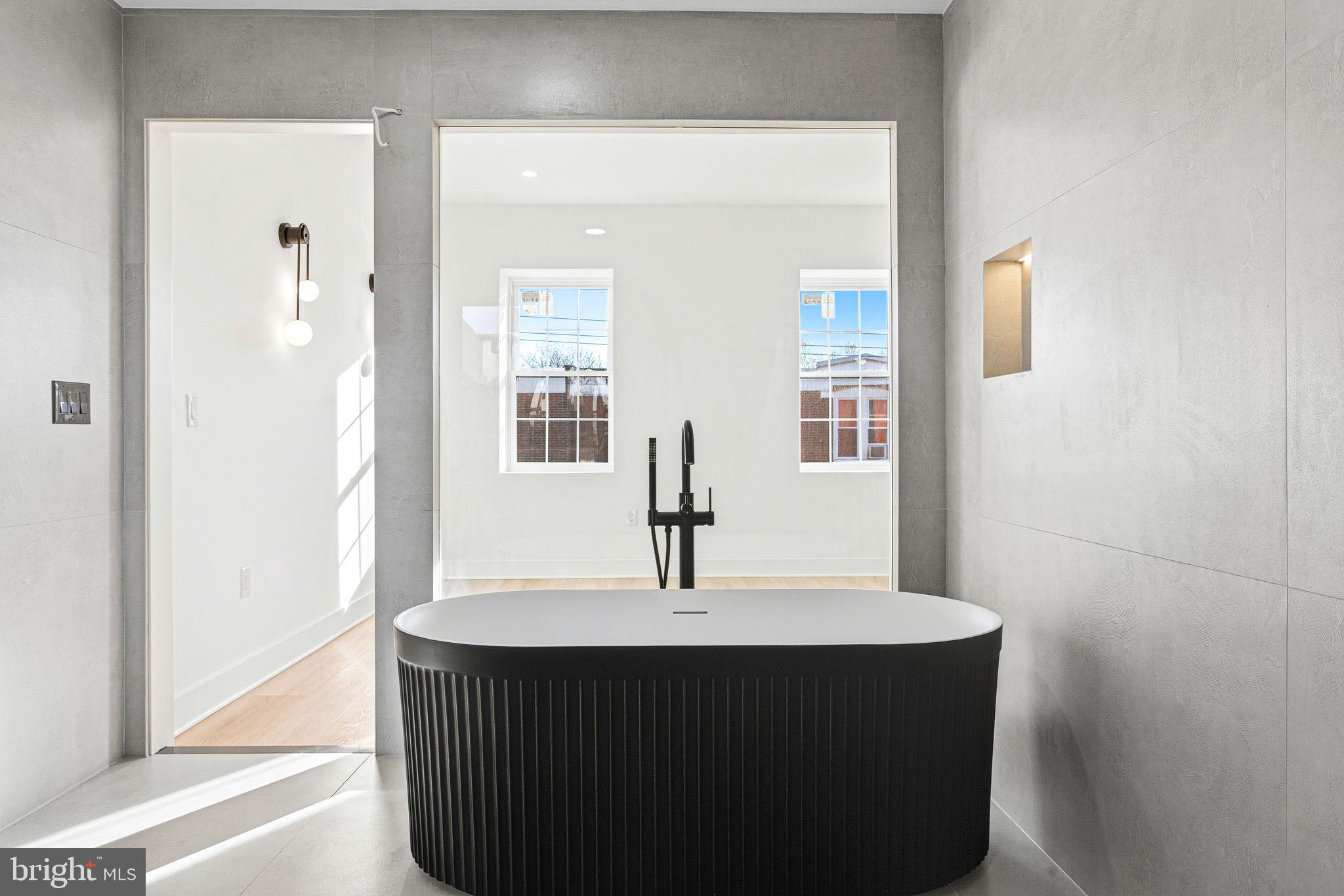 1419 Wharton Street Philadelphia, PA 19146 - Photo 27 of 39 a kitchen with a sink and a mirror