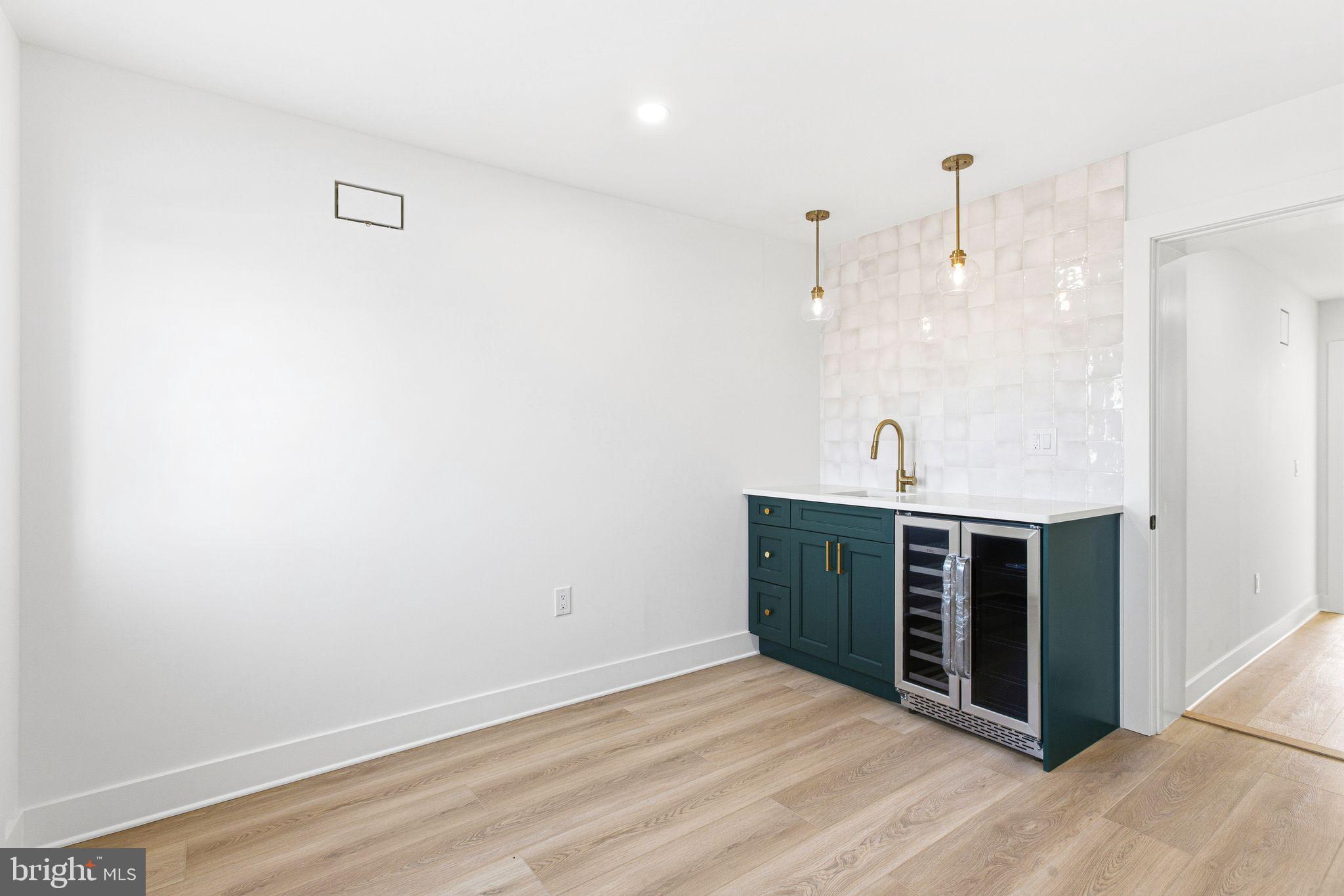 1419 Wharton Street Philadelphia, PA 19146 - Photo 28 of 39 a view of a kitchen with wooden floor and a sink