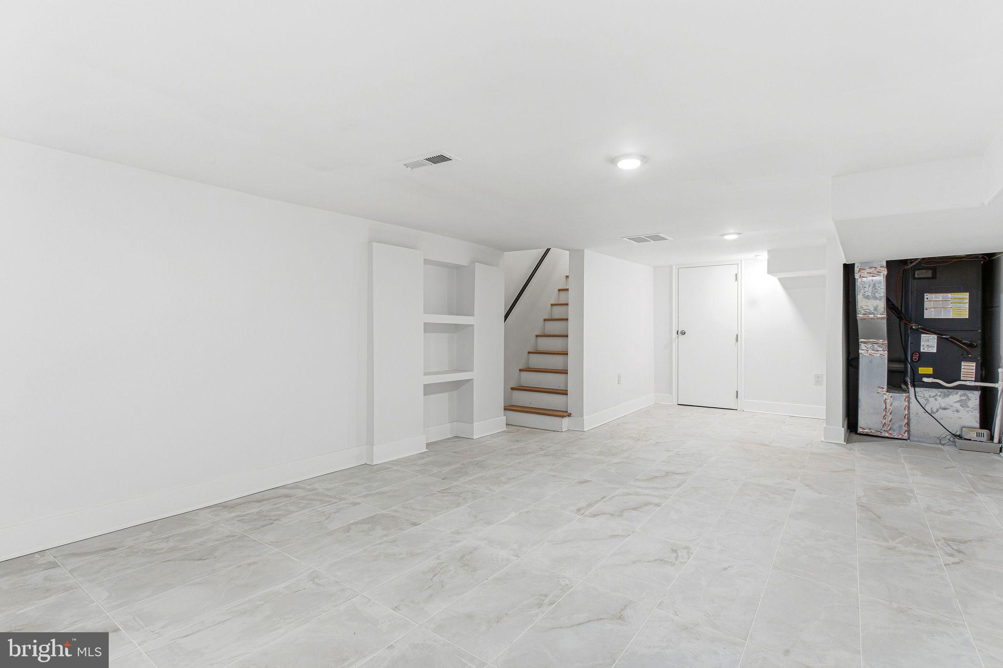 1419 Wharton Street Philadelphia, PA 19146 - Photo 32 of 39 an empty room with a white wall and closet