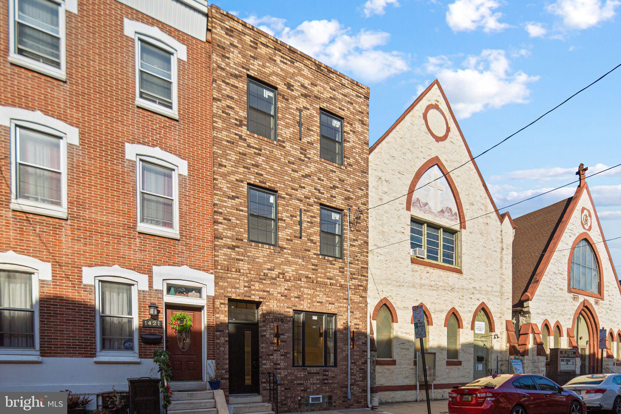 1419 Wharton Street Philadelphia, PA 19146 - Photo 37 of 39 a view of a brick building with many windows