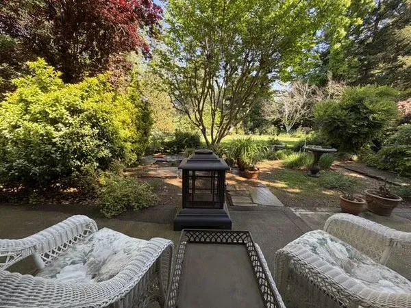 a view of a couches in the patio with a fire pit