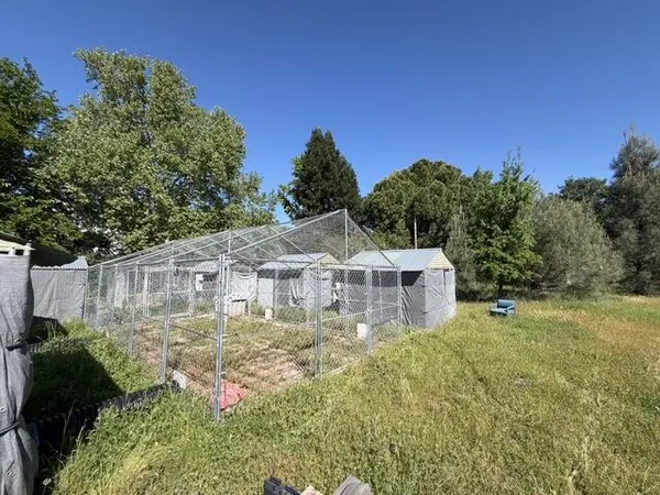 a view of a lake with a house in the background