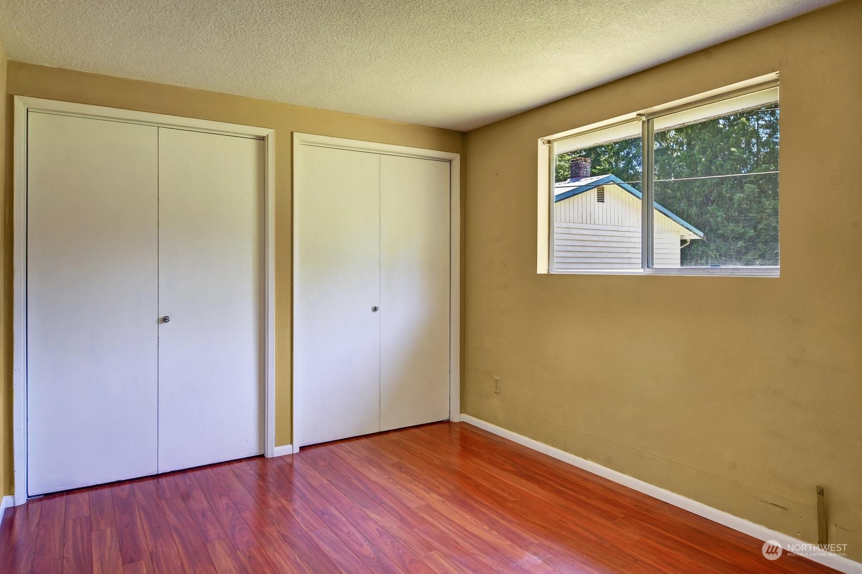 21 North Machias Road Snohomish, WA 98290 - Photo 12 of 21 an empty room with wooden floor and windows