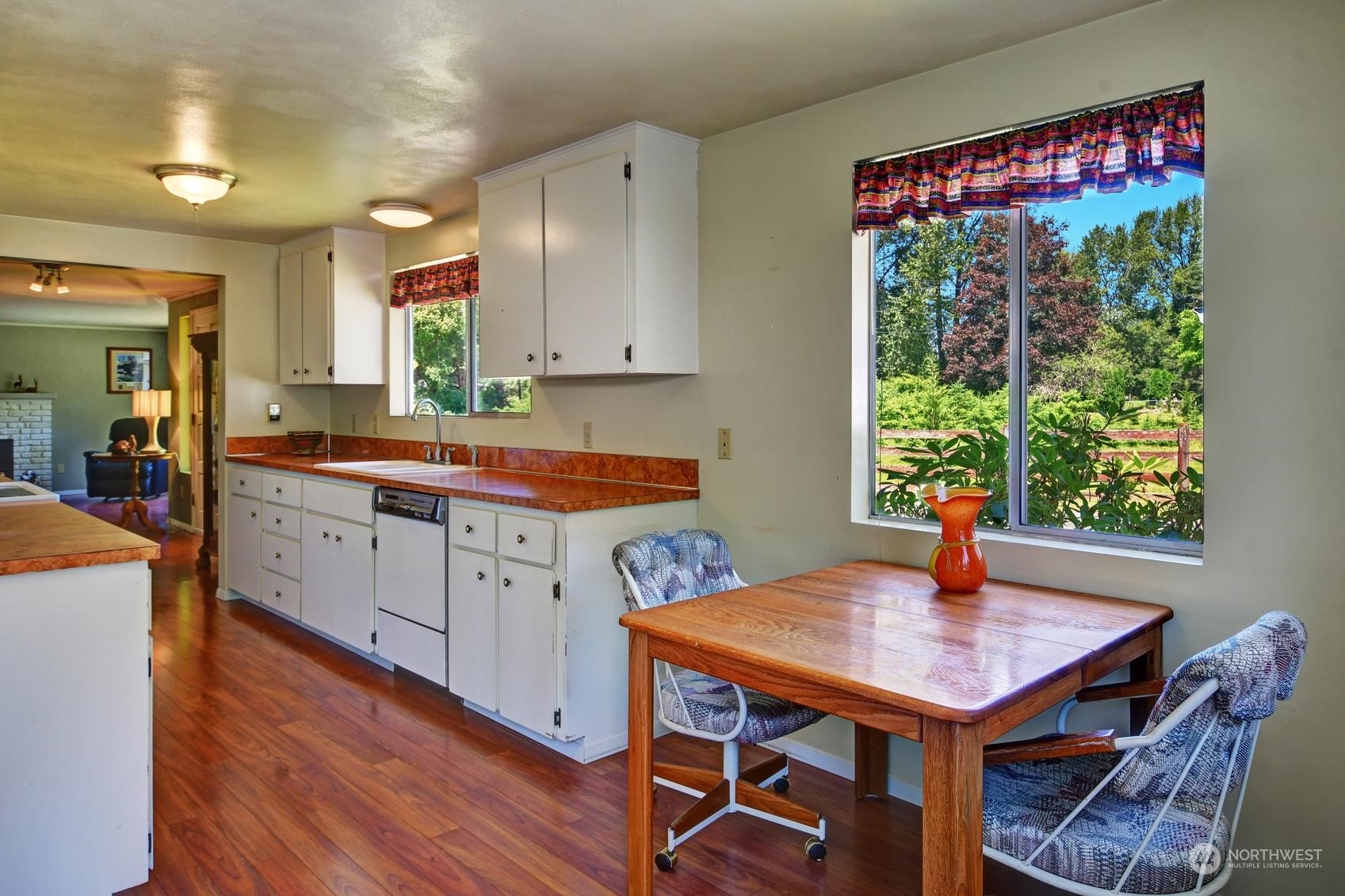 21 North Machias Road Snohomish, WA 98290 - Photo 4 of 21 a kitchen with a table chairs sink and wooden floor