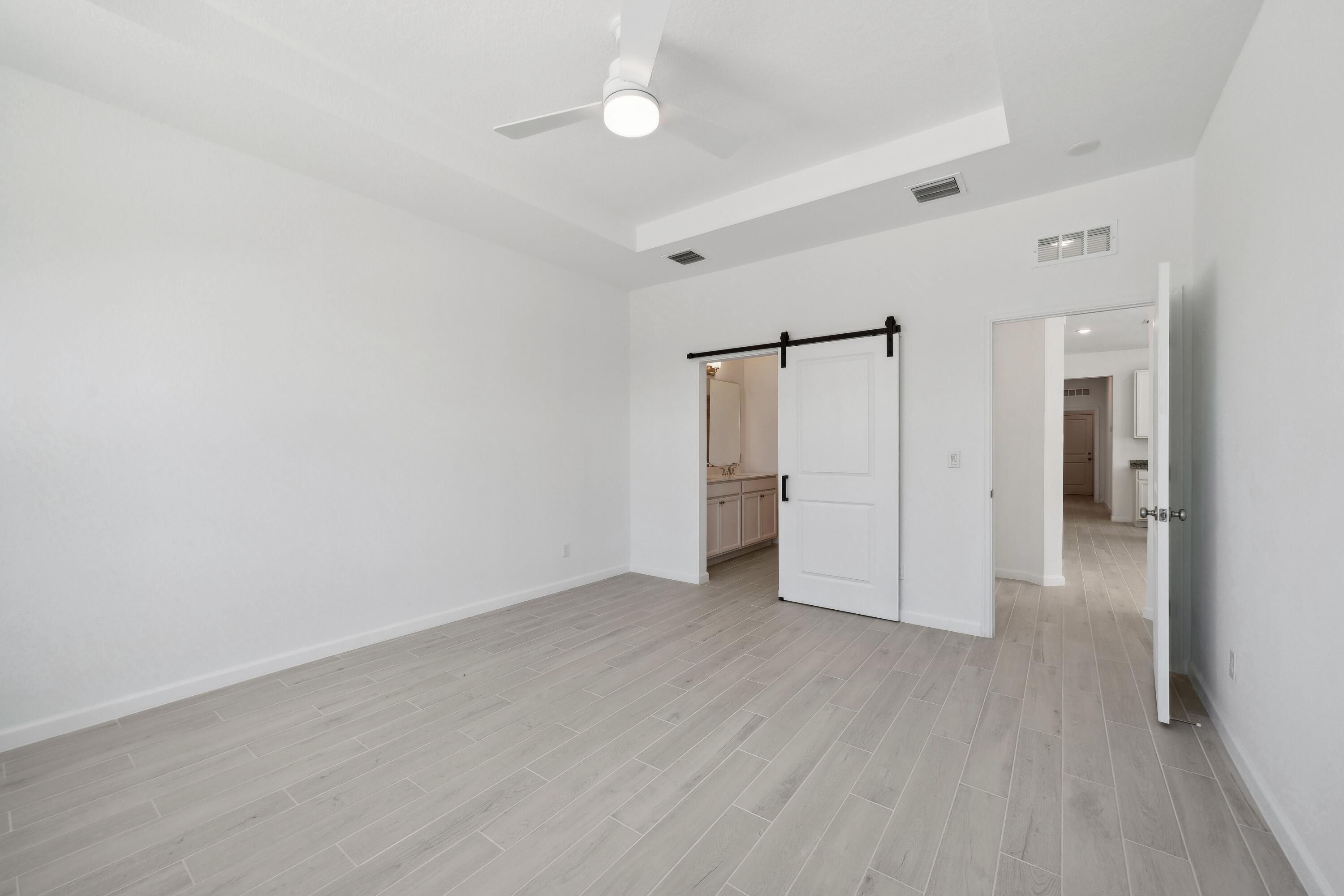 10115 Dreamweaver Road, Unit 49 Port St. Lucie, FL 34987 - Photo 17 of 36 Primary Suite