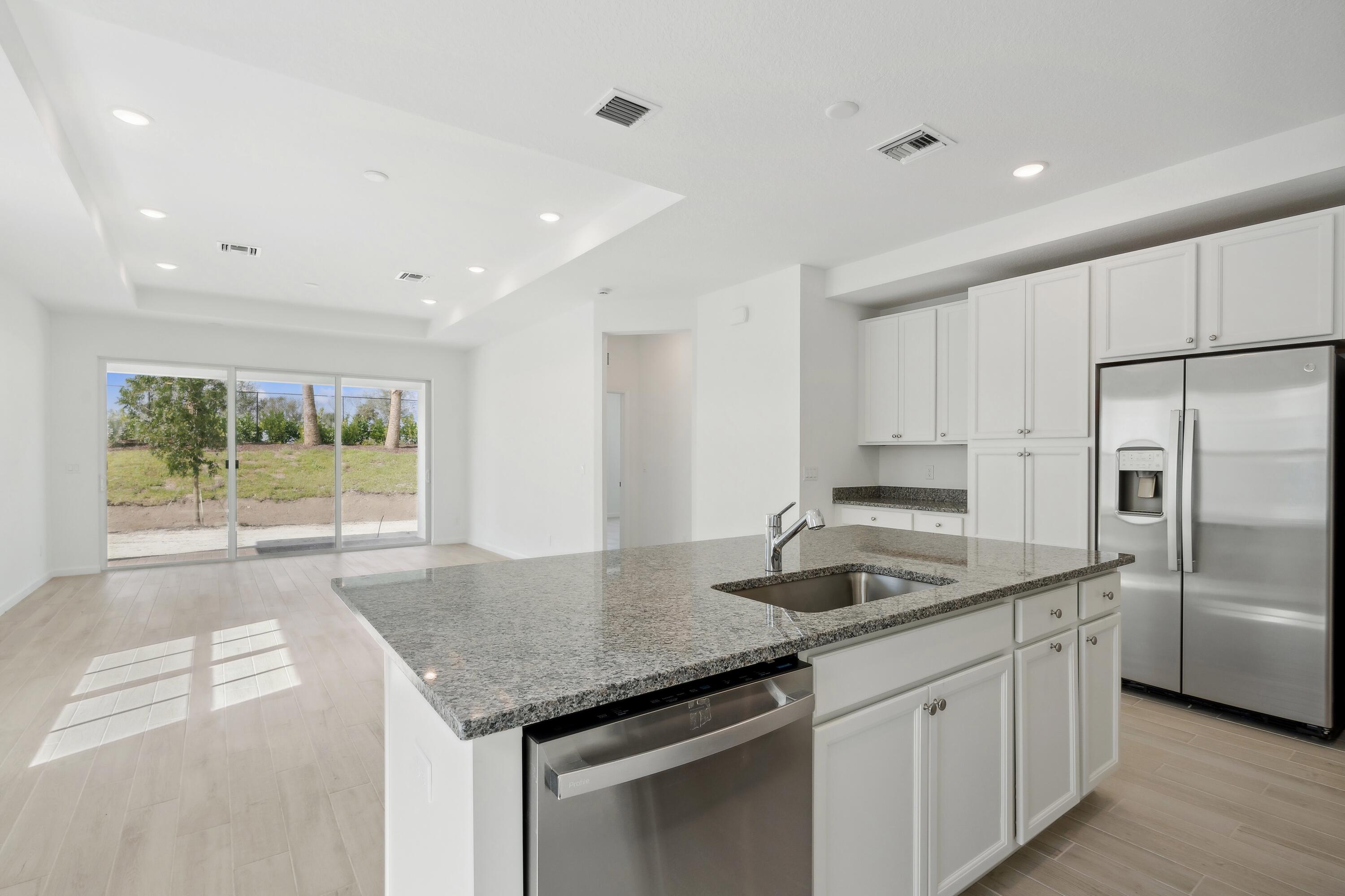 10115 Dreamweaver Road, Unit 49 Port St. Lucie, FL 34987 - Photo 5 of 36 Kitchen, Dining Area & Great Room