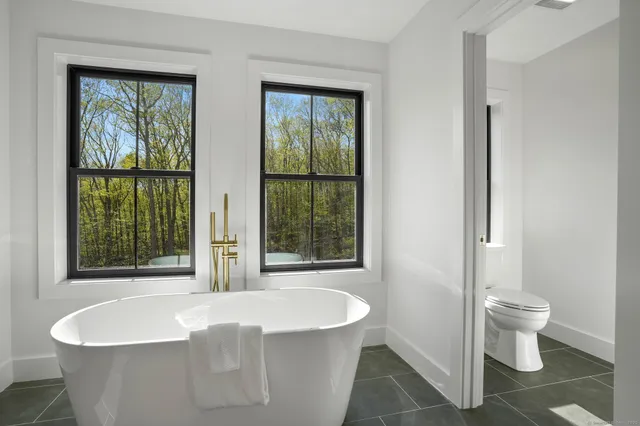 a bathroom with a double vanity sink mirror and