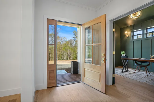 a workspace room with furniture and rug