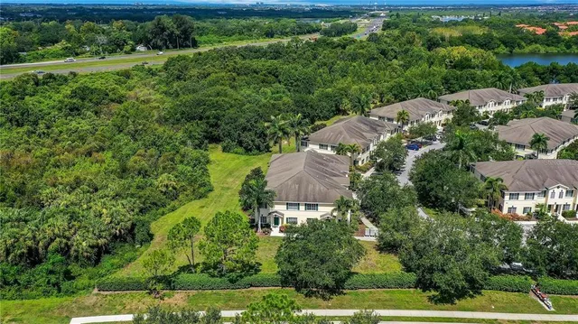 an aerial view of a house with a yard