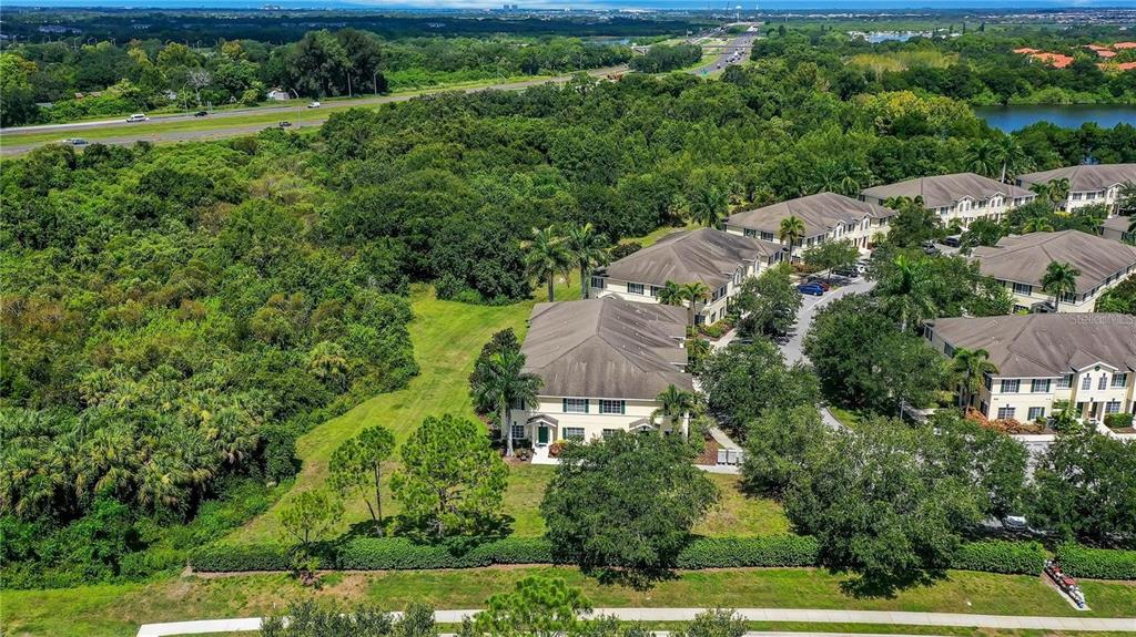 280 Cape Harbour Loop, Unit 101 Bradenton, FL 34212 - Photo 21 of 35 an aerial view of a house with a yard