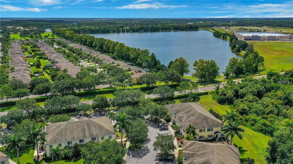 280 Cape Harbour Loop, Unit 101 Bradenton, FL 34212 - Photo 22 of 35 an aerial view of a residential houses with outdoor space and lake view