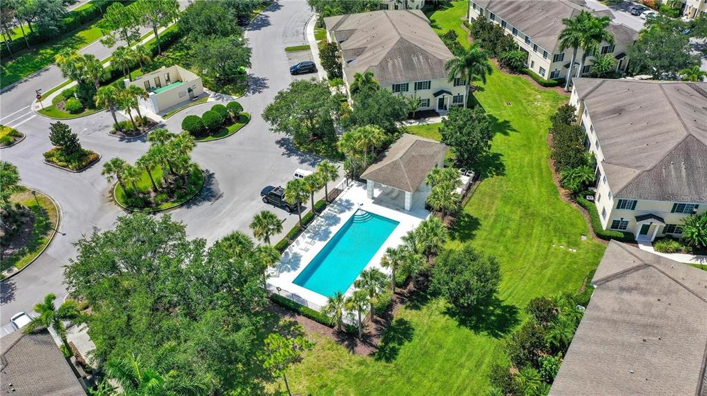 280 Cape Harbour Loop, Unit 101 Bradenton, FL 34212 - Photo 25 of 35 an aerial view of a house with garden space and street view