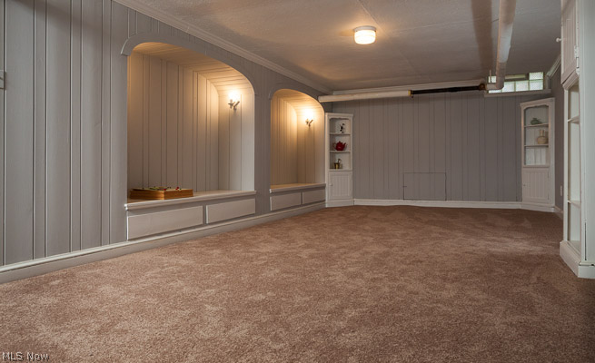 3615 Townley Road Beachwood, OH 44122 - Photo 10 of 13 Lower Level Recreation Room/Game Room is a fun and functional gathering place out of the traffic flow of the home. This room features newer Carpet, Fresh Paint, and the privacy and good looks of Glass Block Windows. A newer water heater is found in the utility room just off the Recreation Room.