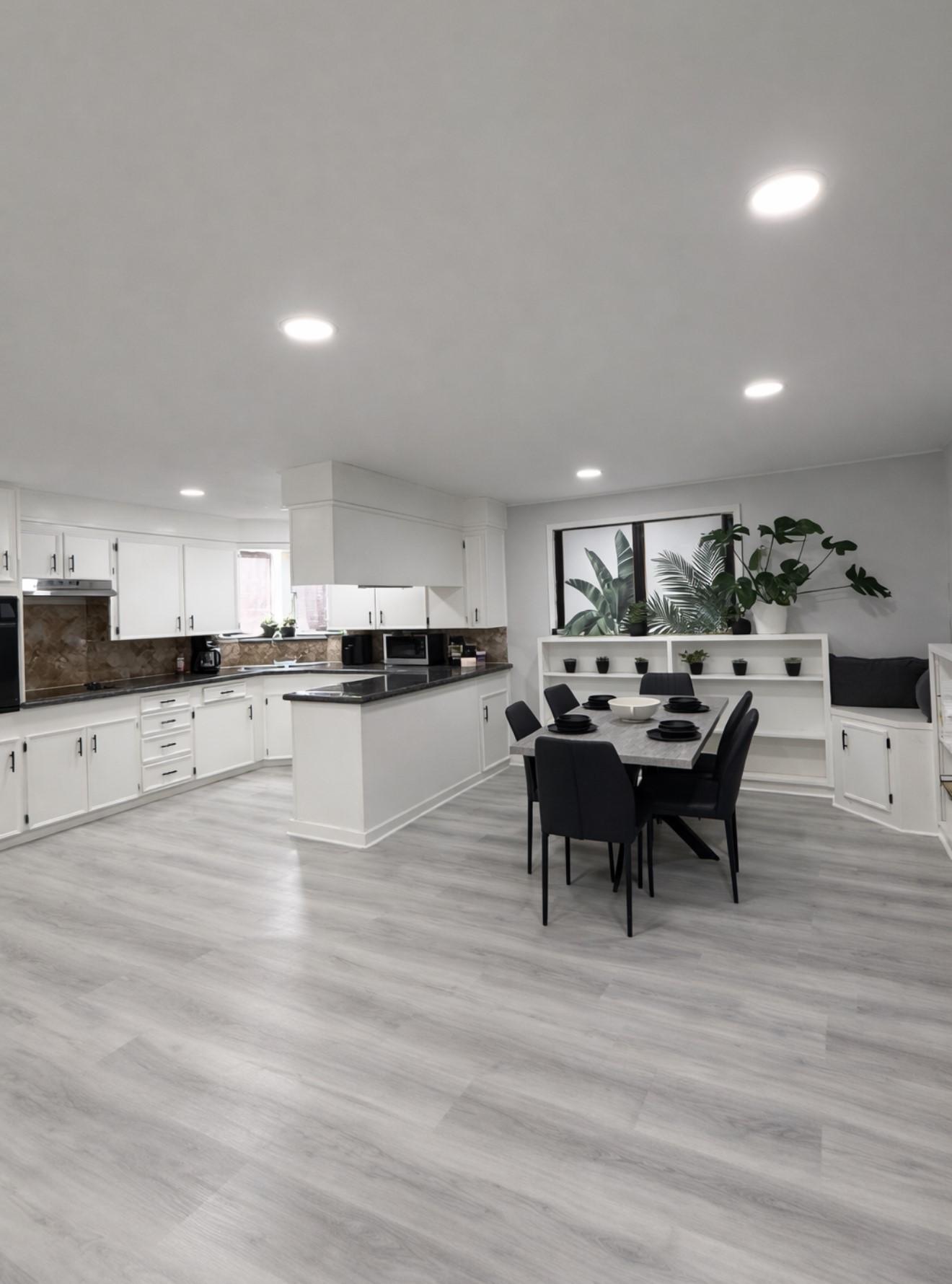 801 Trinity Street Anahuac, TX 77514 - Photo 2 of 9 a kitchen with a table and chairs in it