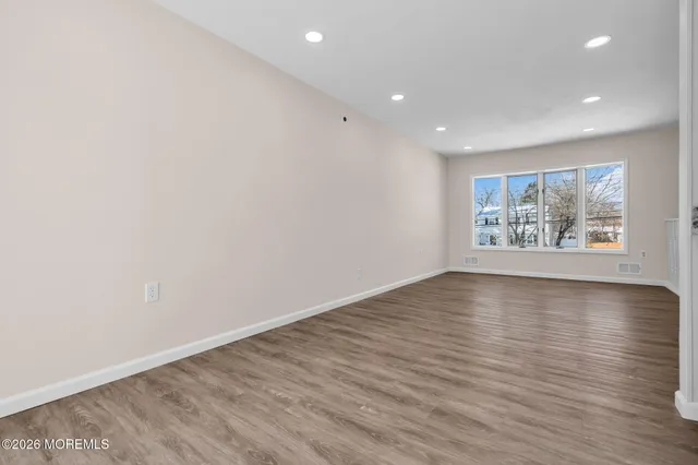 a bathroom with a toilet a sink and shower
