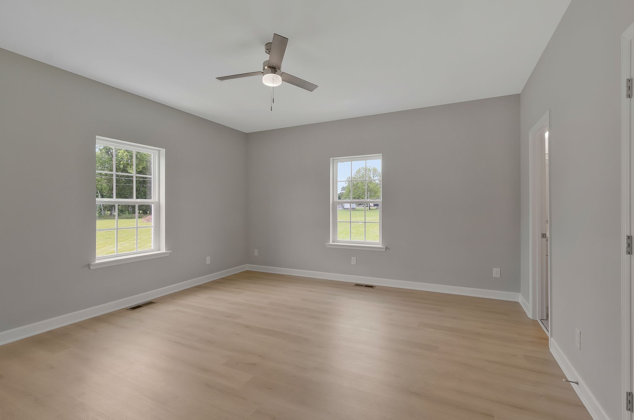 1435 Unionville Deason Road Unionville, TN 37180 - Photo 19 of 33 a view of an empty room with a window and wooden floor