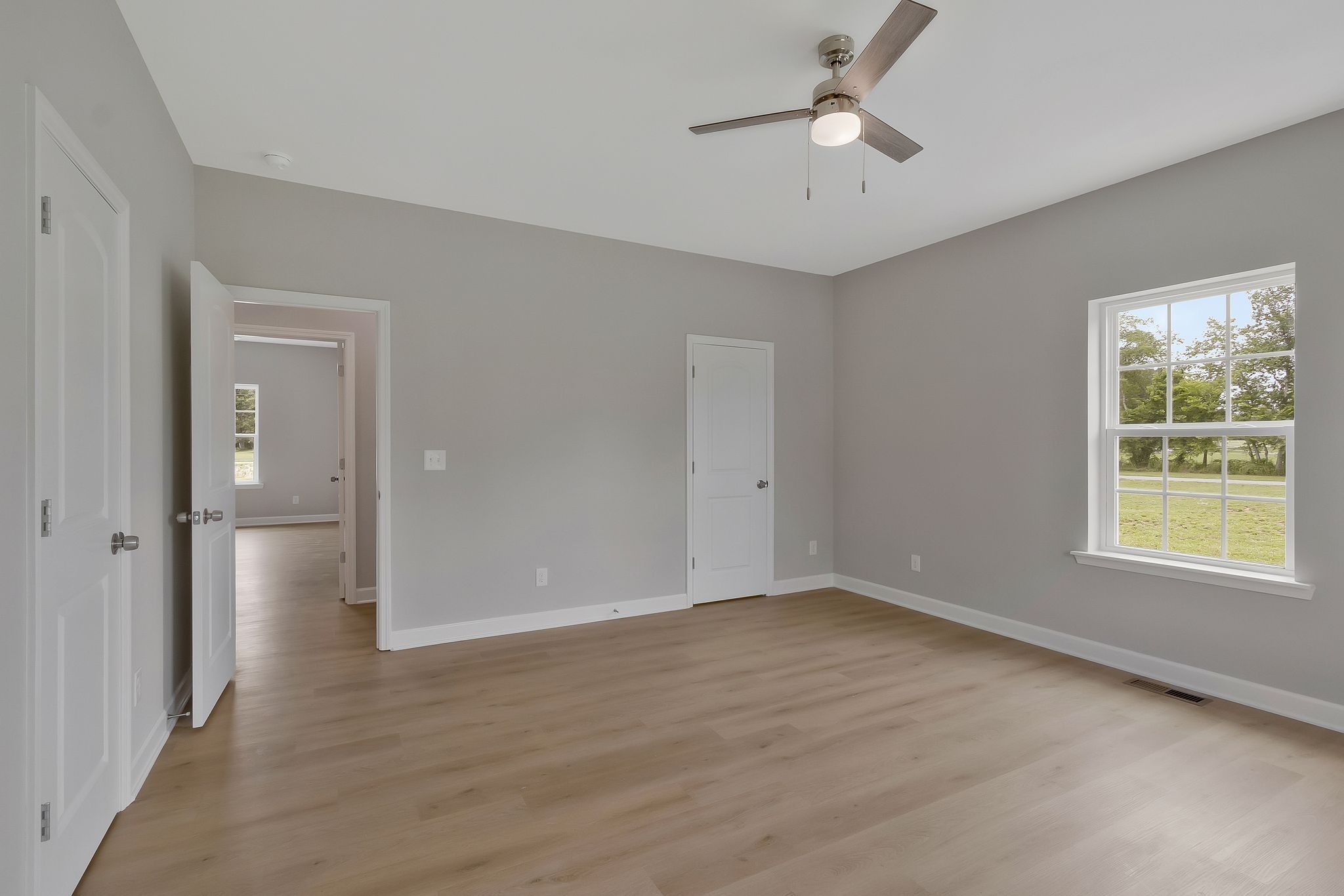 1435 Unionville Deason Road Unionville, TN 37180 - Photo 21 of 33 a view of an empty room with a window and a kitchen
