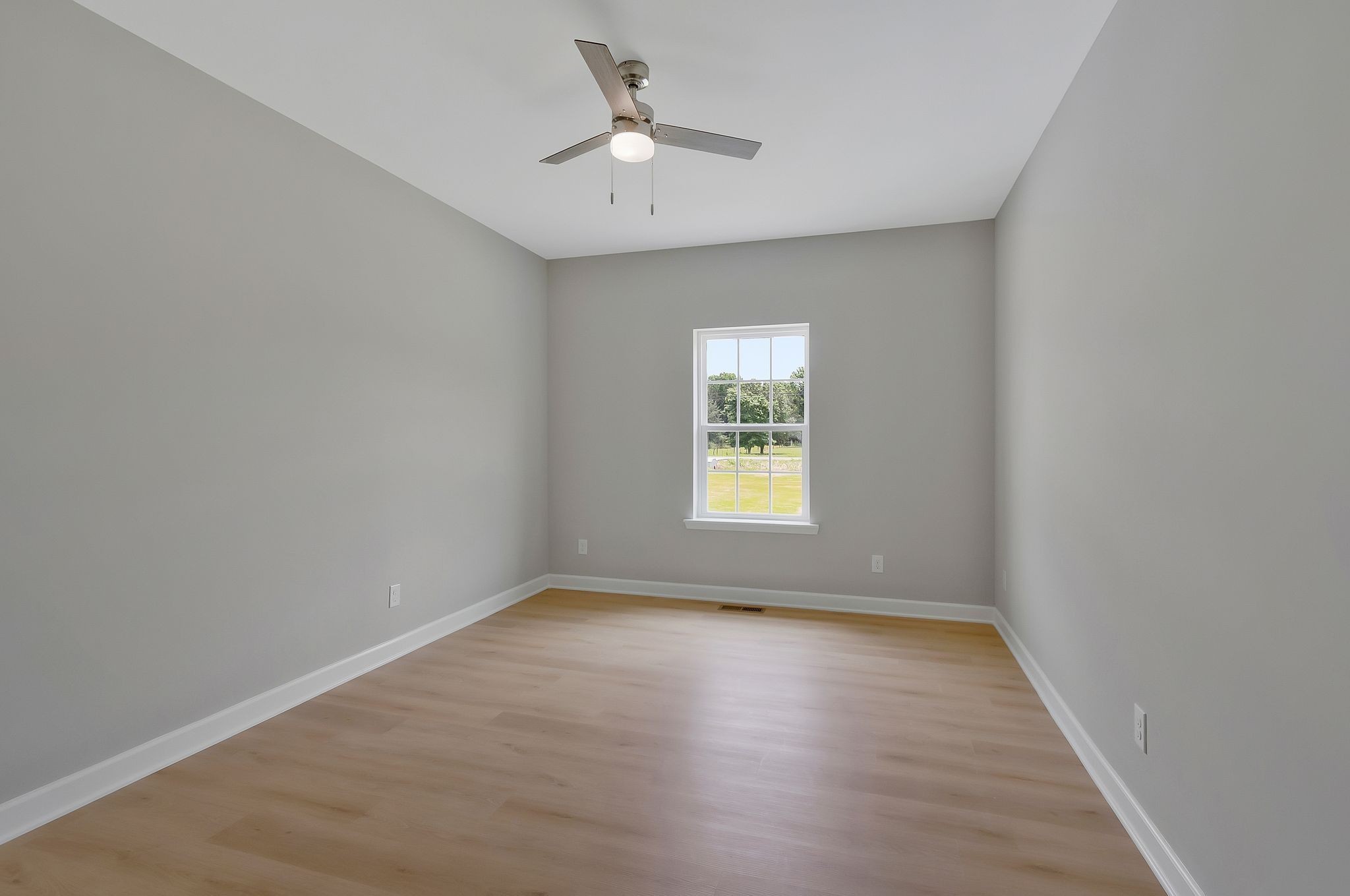 1435 Unionville Deason Road Unionville, TN 37180 - Photo 24 of 33 an empty room with a window and a fan