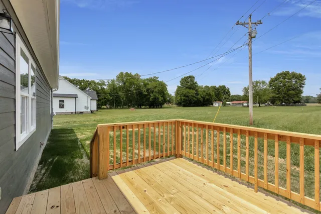 a view of a balcony with wooden floor