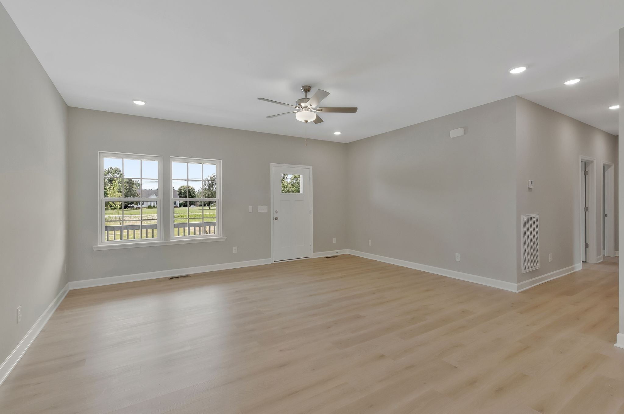 1435 Unionville Deason Road Unionville, TN 37180 - Photo 8 of 33 an empty room with windows and ceiling fan