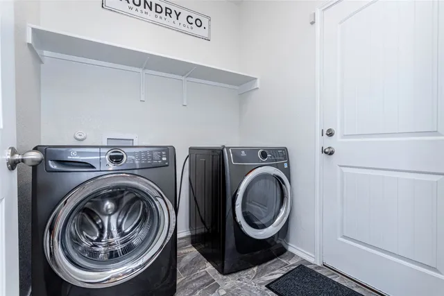 a utility room with dryer and washer
