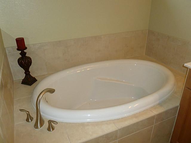 150 Southwest Walking Path Stuart, FL 34997 - Photo 17 of 25 a bathroom with a bathtub