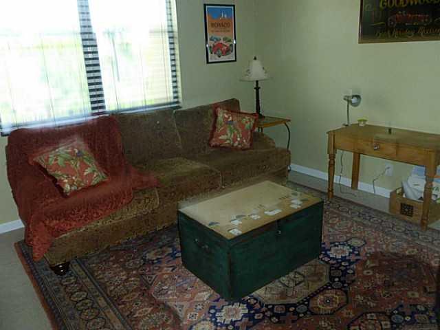 150 Southwest Walking Path Stuart, FL 34997 - Photo 21 of 25 a living room with furniture and a window