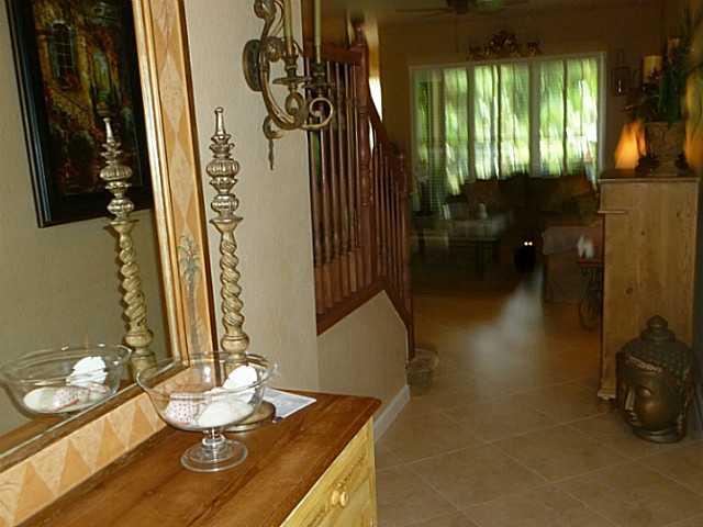 150 Southwest Walking Path Stuart, FL 34997 - Photo 4 of 25 a dining room with furniture and wooden floor