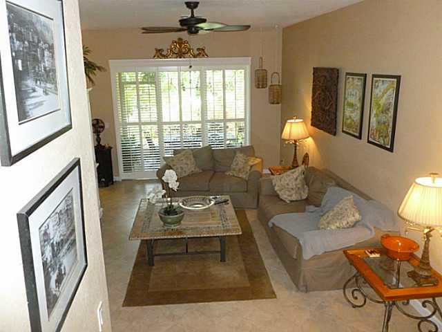 150 Southwest Walking Path Stuart, FL 34997 - Photo 5 of 25 a living room with furniture and a window