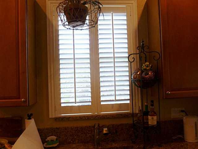 150 Southwest Walking Path Stuart, FL 34997 - Photo 10 of 25 a bathroom with a window and a shower