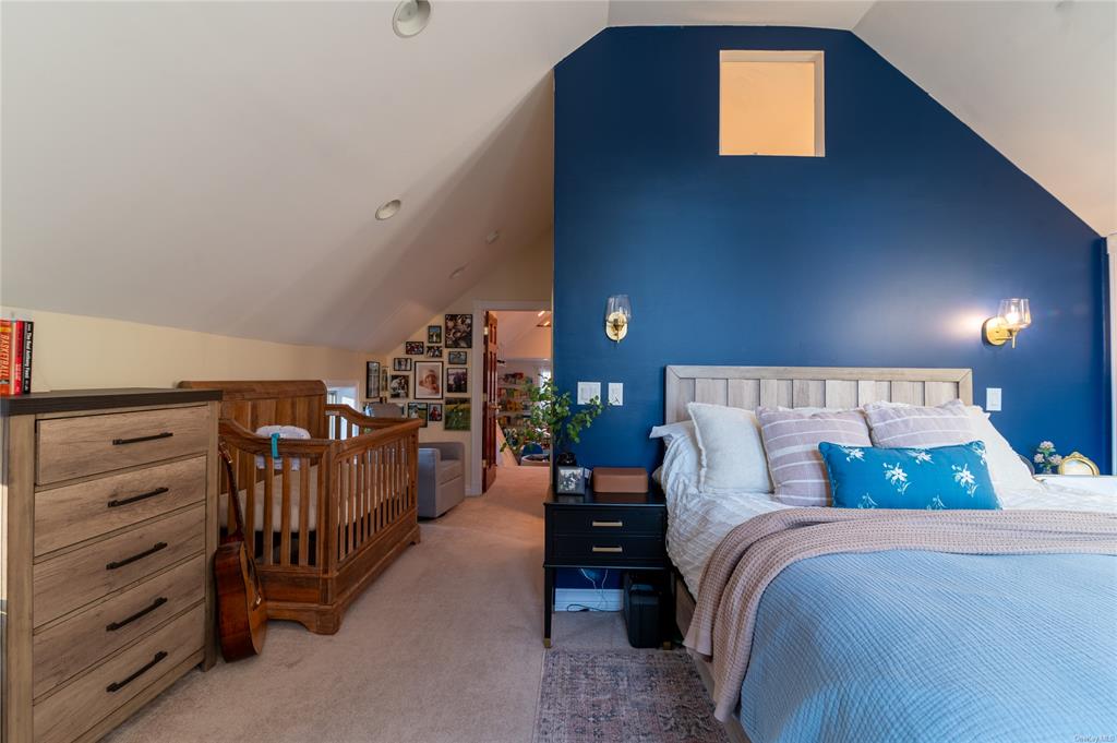 374 Hill Road Jeffersonville, NY 12748 - Photo 14 of 36 Carpeted bedroom with lofted ceiling