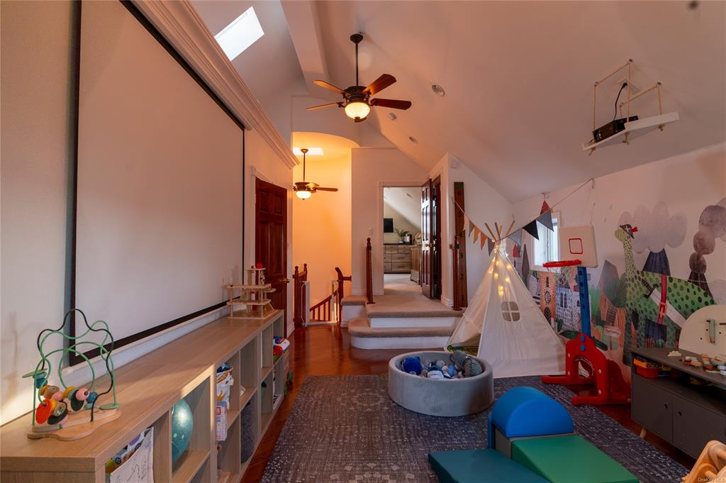 374 Hill Road Jeffersonville, NY 12748 - Photo 16 of 36 Game room featuring dark hardwood / wood-style flooring, high vaulted ceiling, and ceiling fan