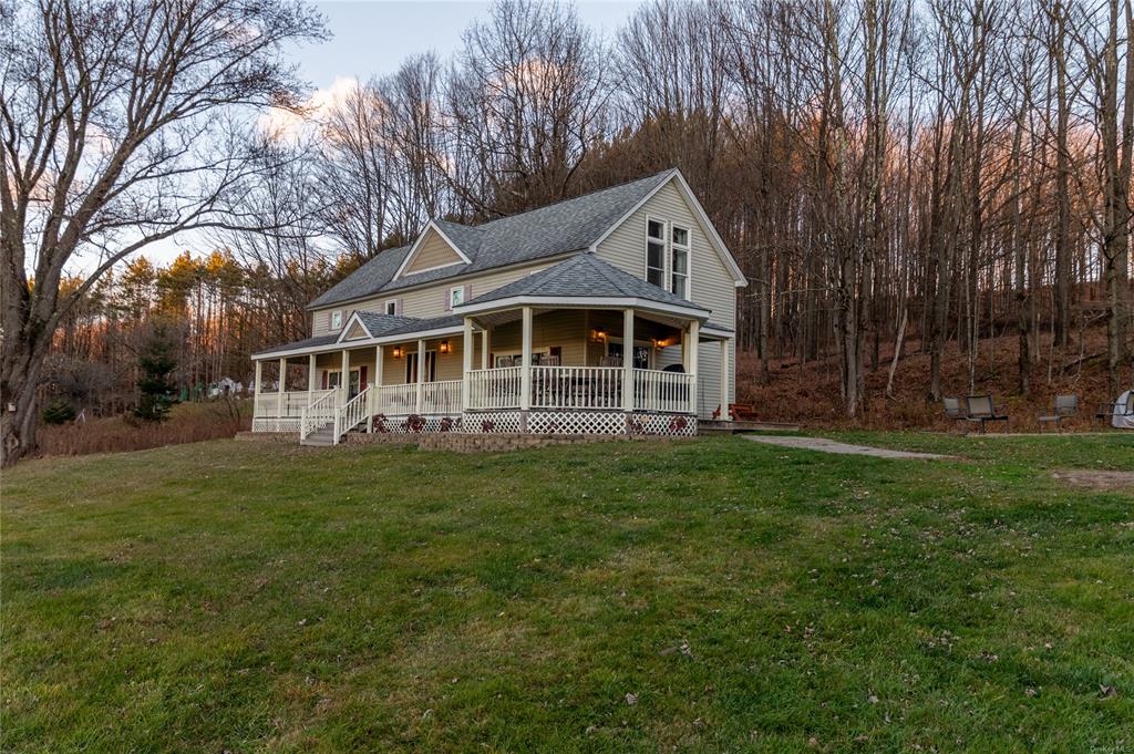374 Hill Road Jeffersonville, NY 12748 - Photo 25 of 36 Farmhouse with covered porch and a front lawn
