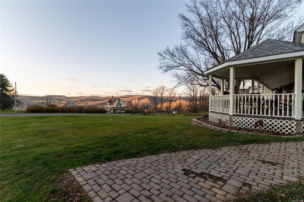 374 Hill Road Jeffersonville, NY 12748 - Photo 6 of 36 Yard at dusk with a mountain view and a patio