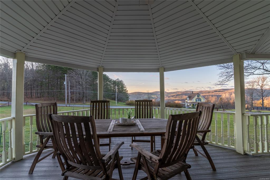 374 Hill Road Jeffersonville, NY 12748 - Photo 8 of 36 Deck at dusk featuring a gazebo and a yard