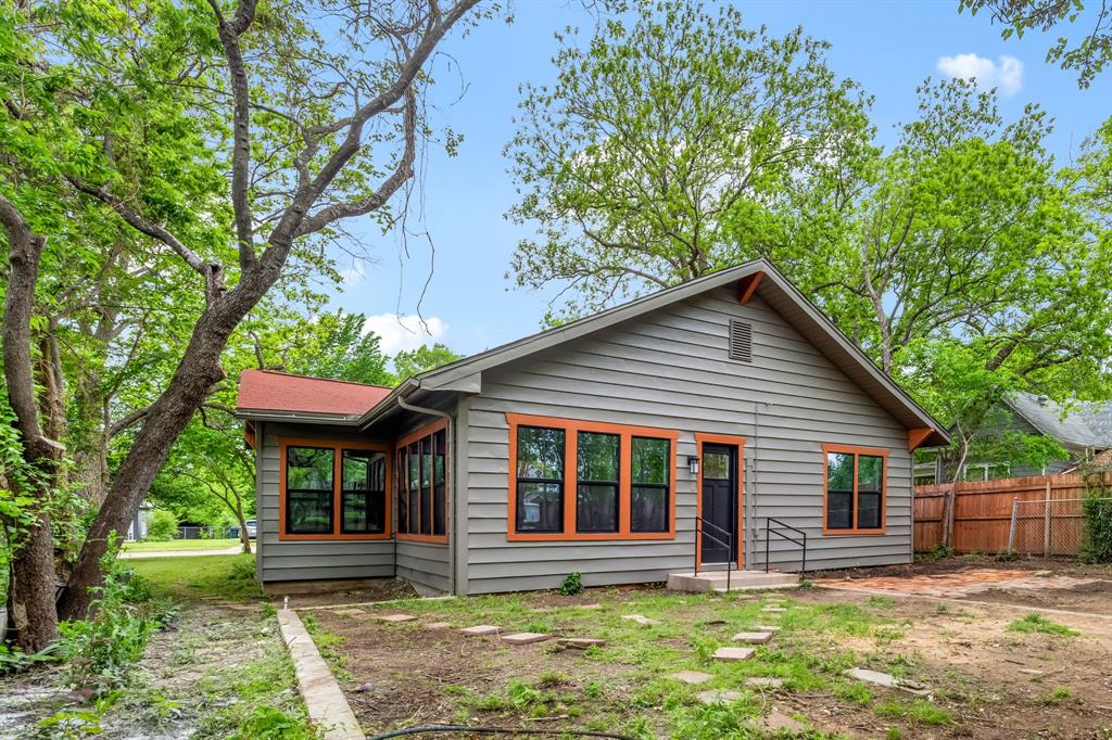 1014 Bolivar Street Denton, TX 76201 - Photo 33 of 36 a front view of house with a garden and patio