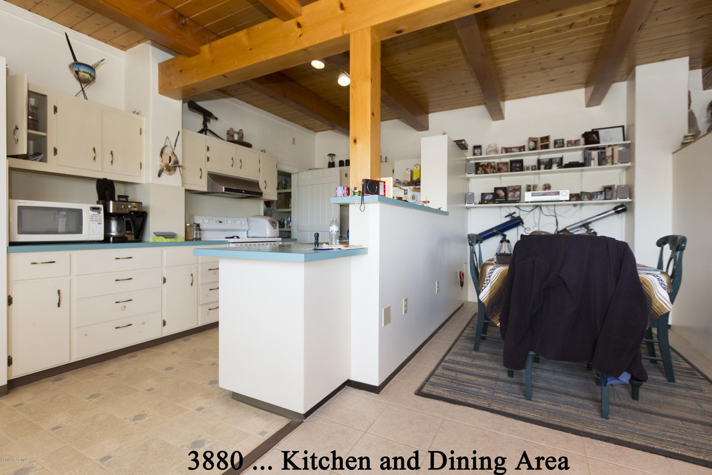 3880-3884 North Reed Road Chino Valley, AZ 86323 - Photo 16 of 30 a kitchen with cabinets and wooden floors