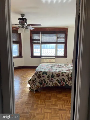 a bedroom with bed and window