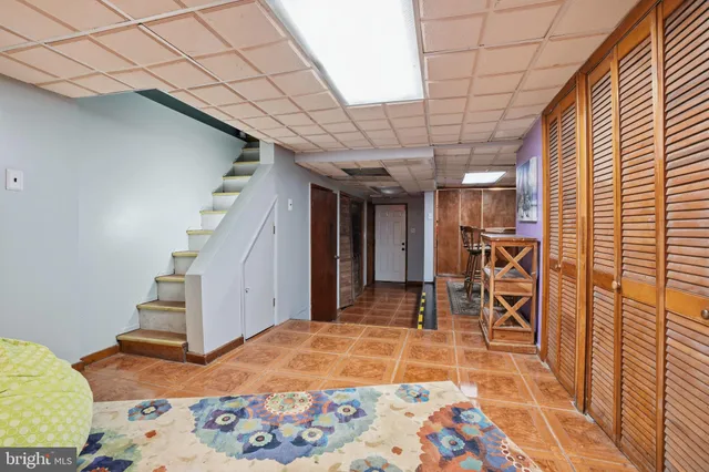 a room with lots of wooden furniture and entryway