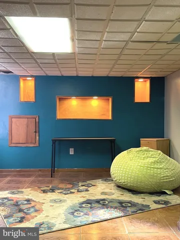 a view of a livingroom with a lounge chair