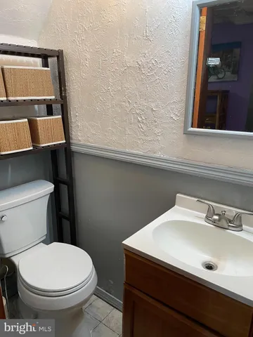 a bathroom with a sink and a toilet