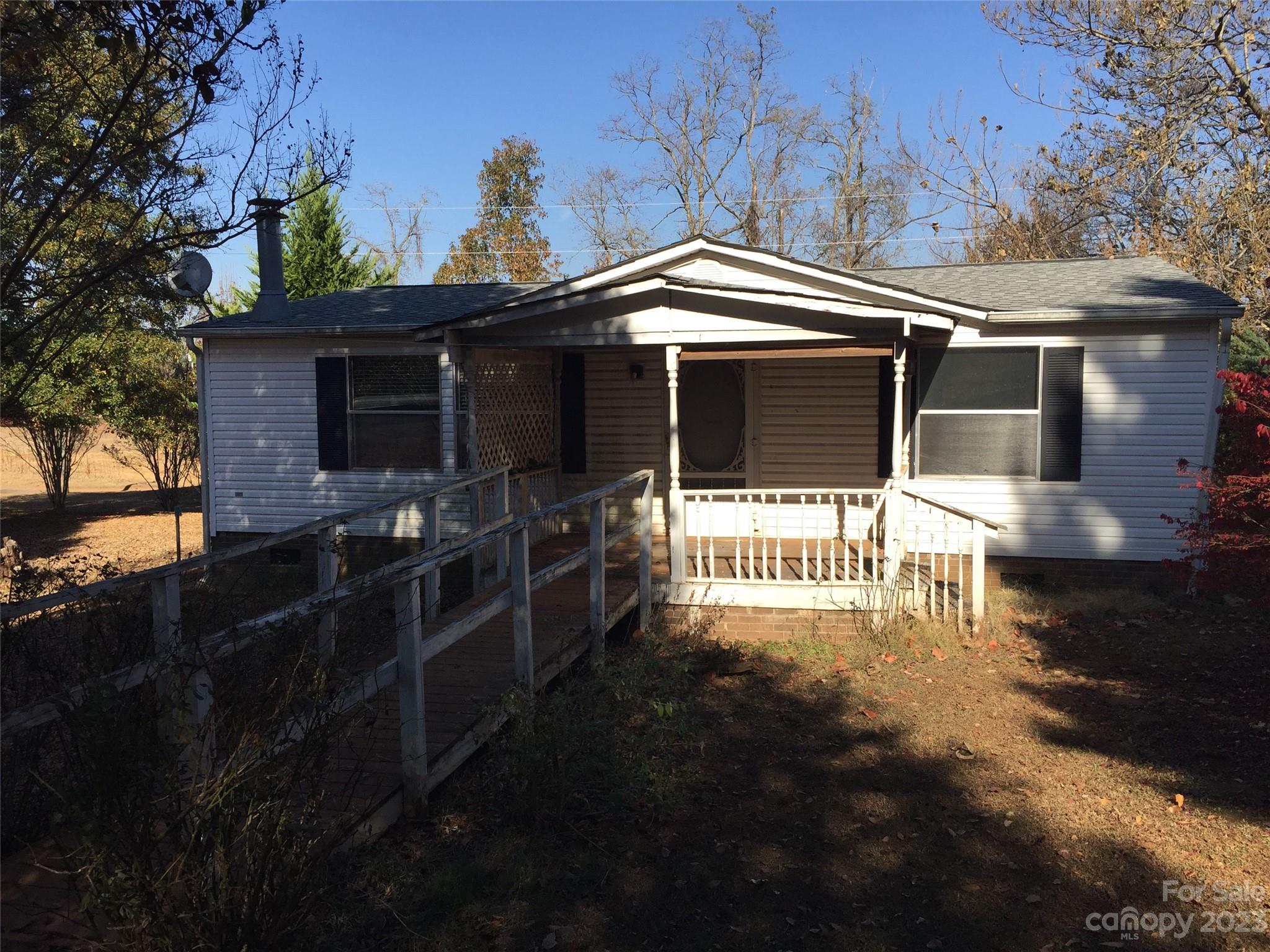 171 Charlie Randall Road Lawndale, NC 28090 - Photo 2 of 28 a front view of a house with a yard