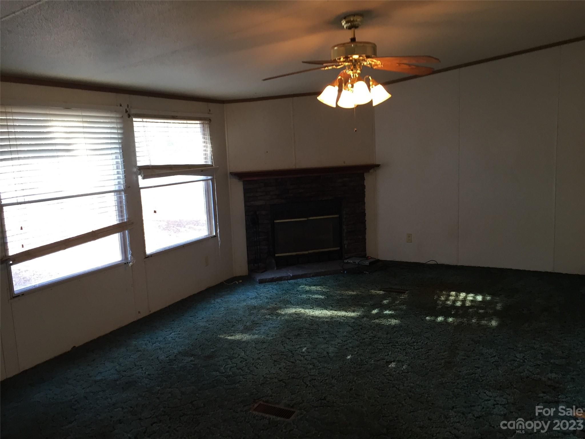 171 Charlie Randall Road Lawndale, NC 28090 - Photo 3 of 28 a view of room with window and fireplace