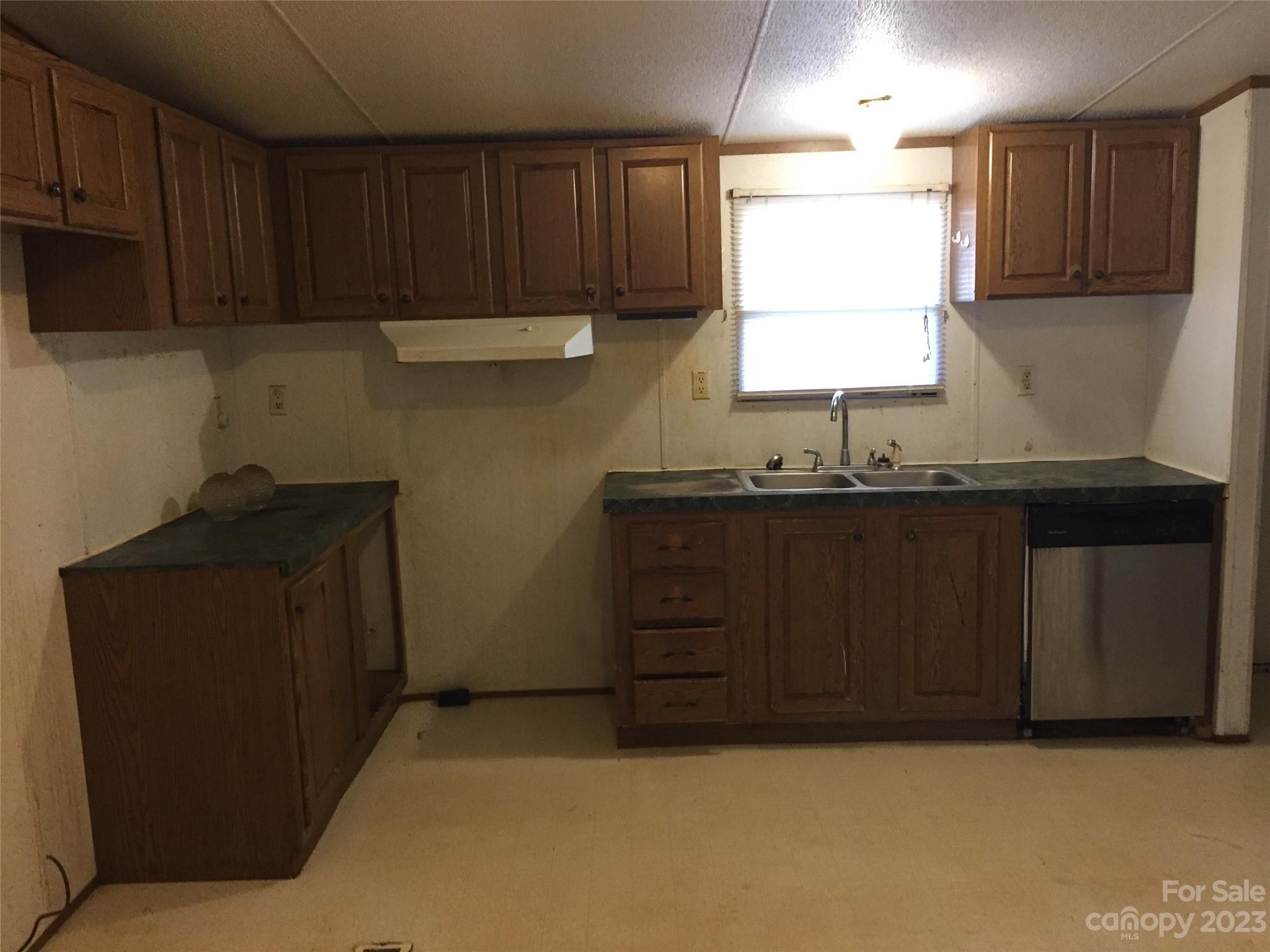 171 Charlie Randall Road Lawndale, NC 28090 - Photo 4 of 28 a kitchen with a sink and cabinets