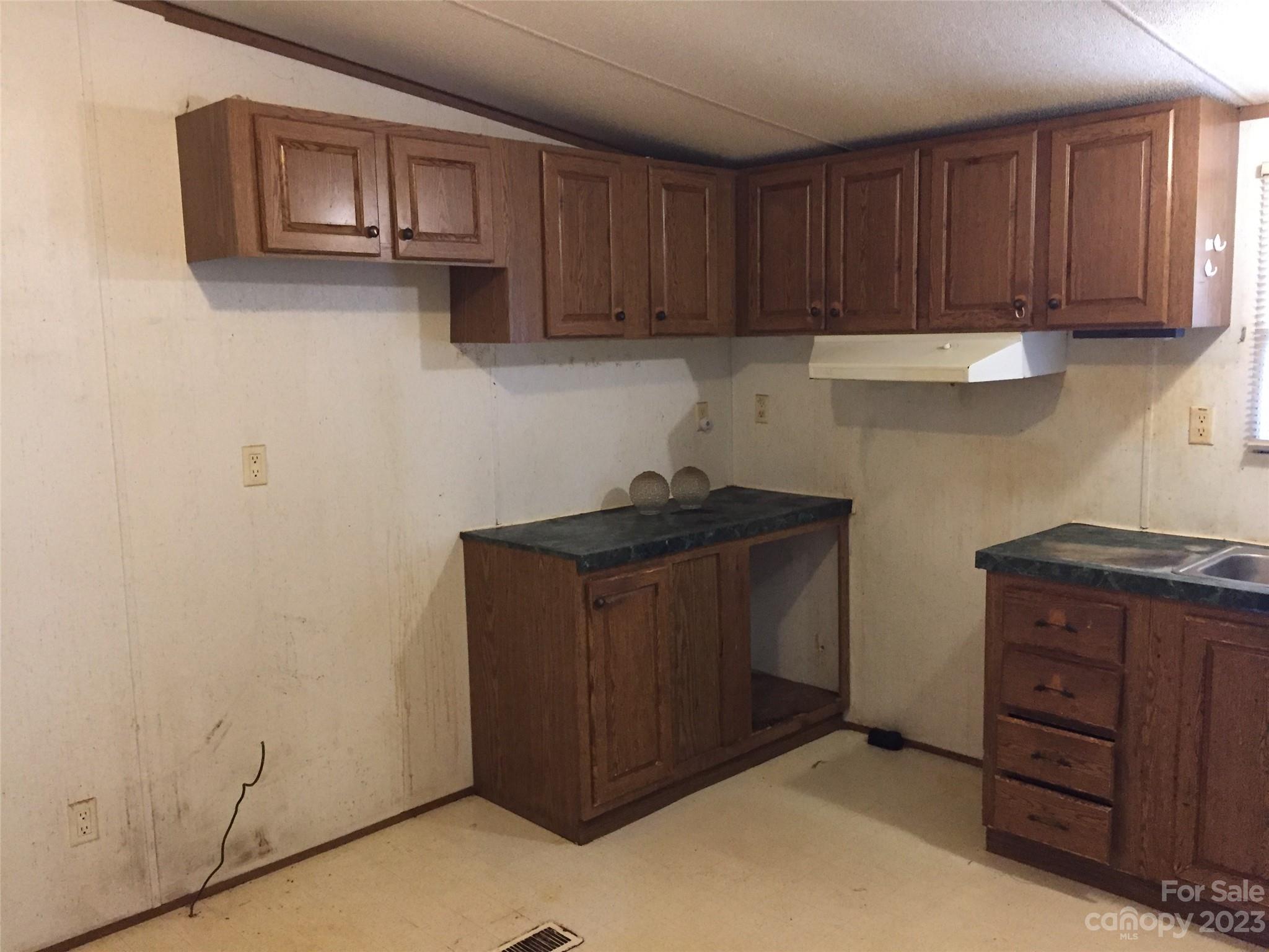 171 Charlie Randall Road Lawndale, NC 28090 - Photo 5 of 28 a kitchen with stainless steel appliances granite countertop a refrigerator a stove and a cabinets