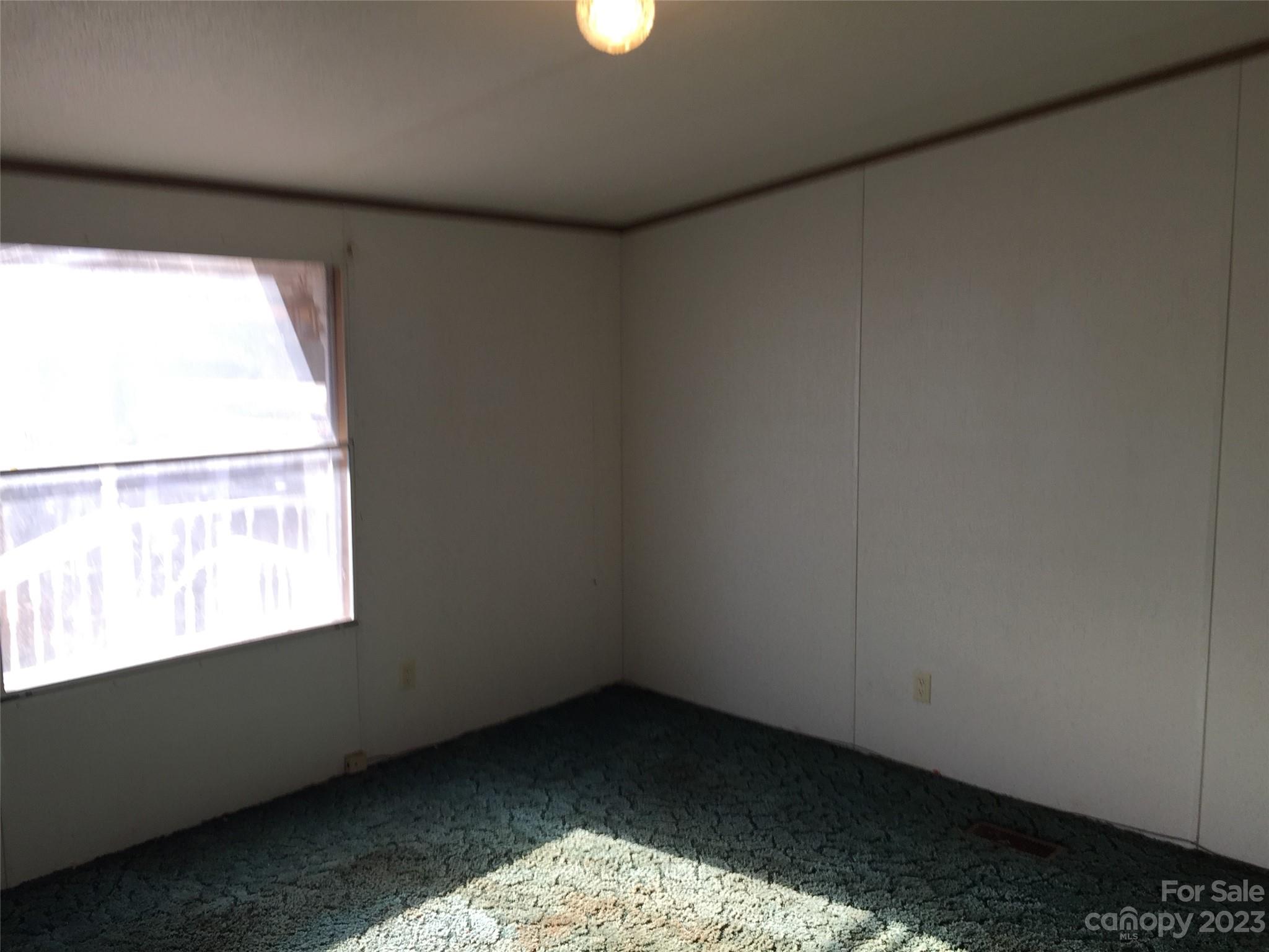 171 Charlie Randall Road Lawndale, NC 28090 - Photo 9 of 28 a view of an empty room and window