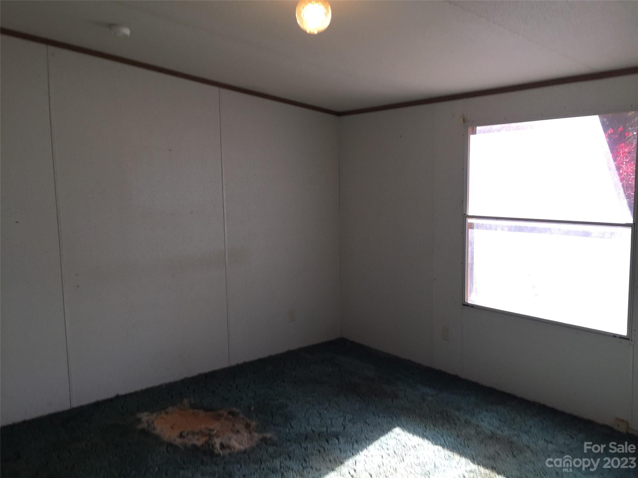 171 Charlie Randall Road Lawndale, NC 28090 - Photo 10 of 28 an empty room with a window