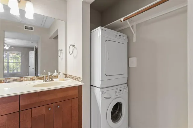a bathroom with a sink a mirror and vanity